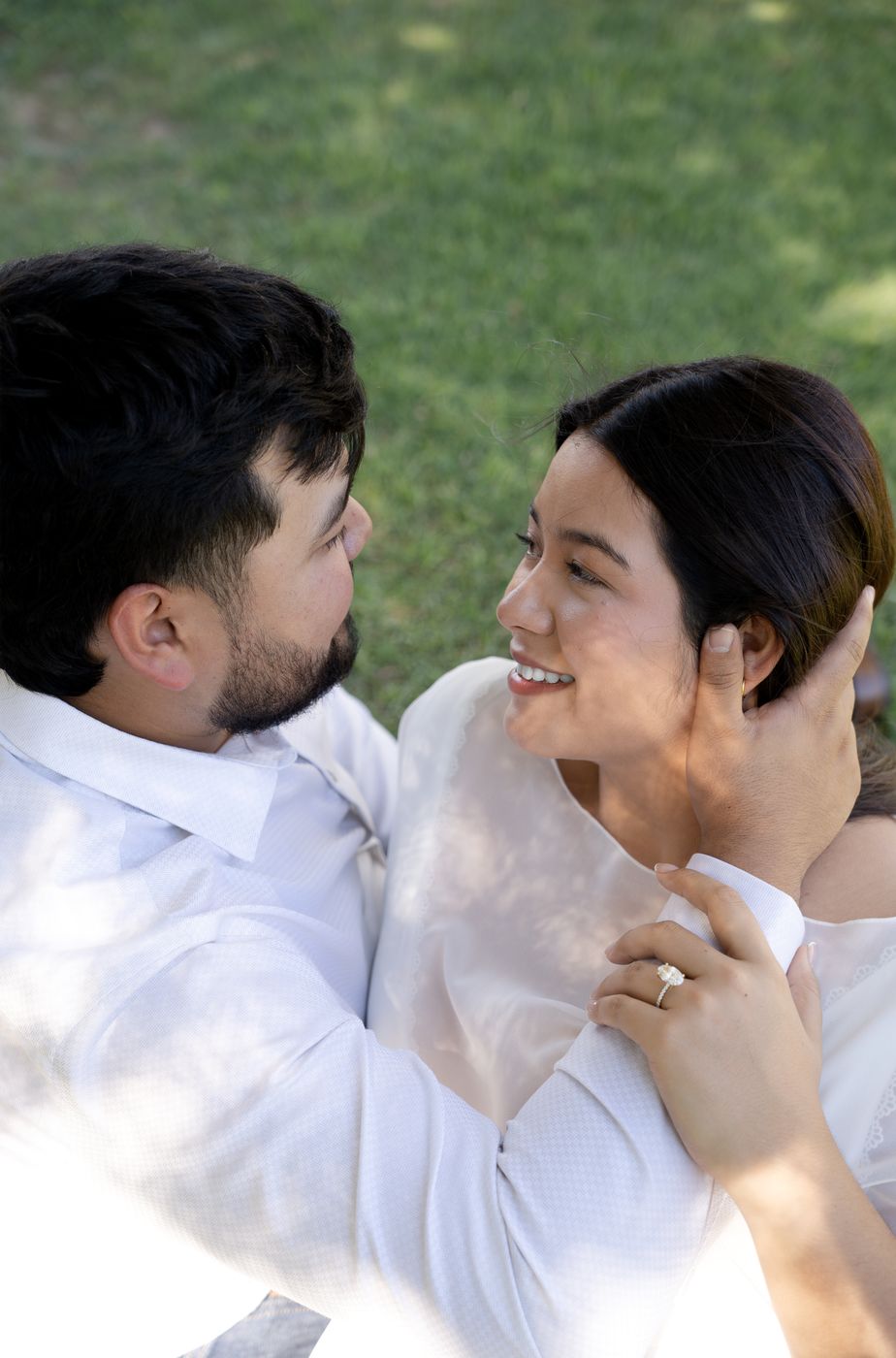 Nicky laughing as Gabe holds her close